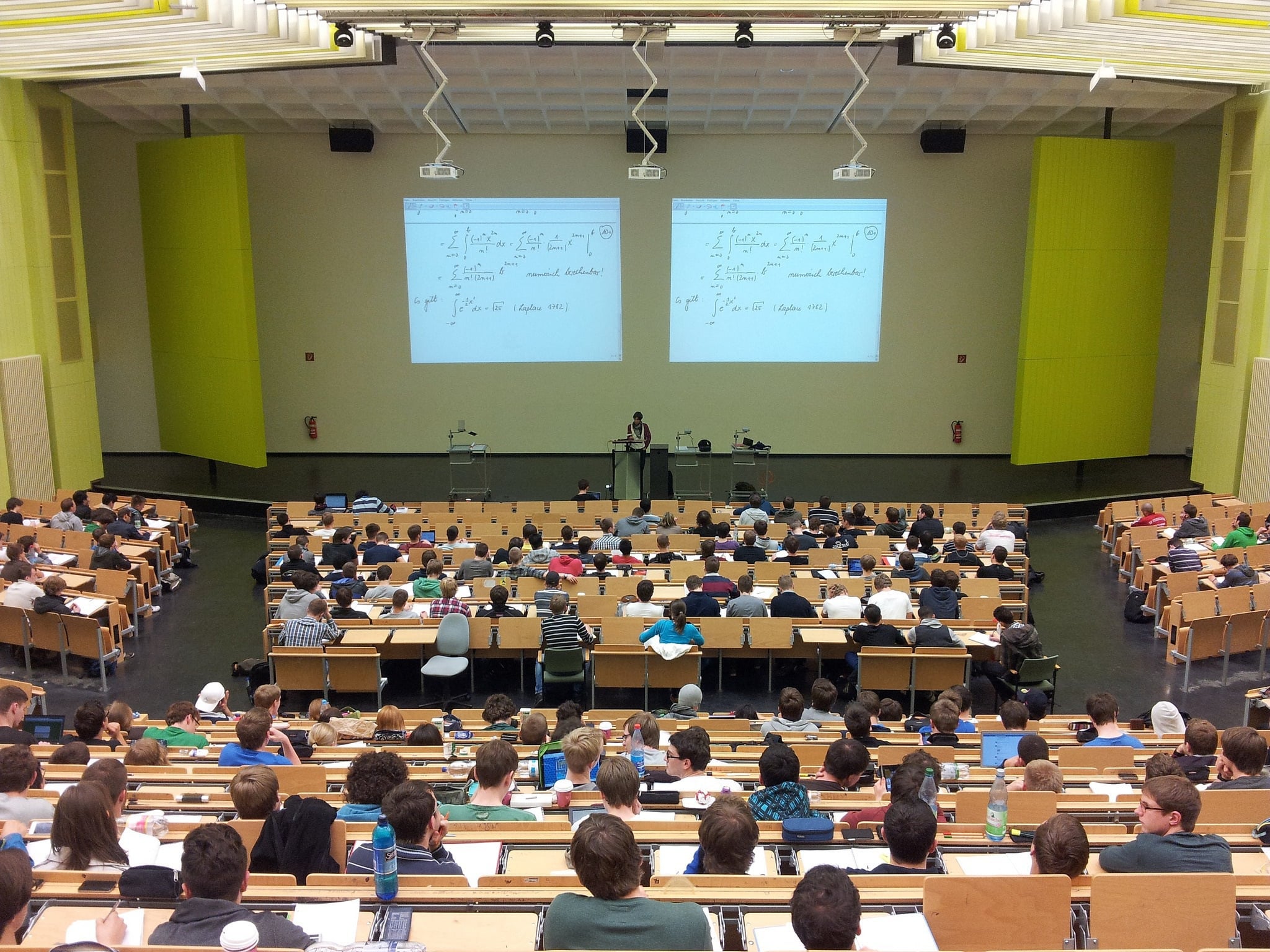 Large university lecture hall filled with students